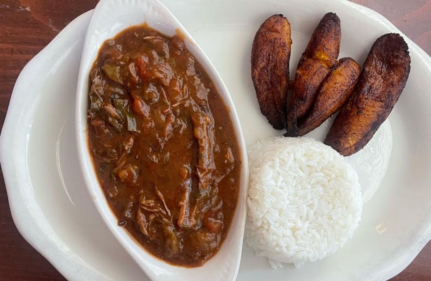 Top view of a Mexican dish with rice and potatoes on the side